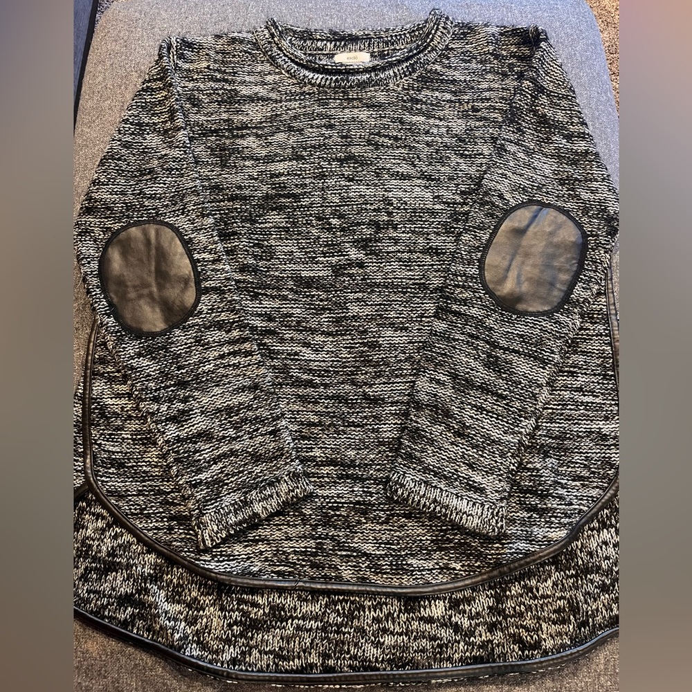 Beautiful sweater with gold detail in the yarn.